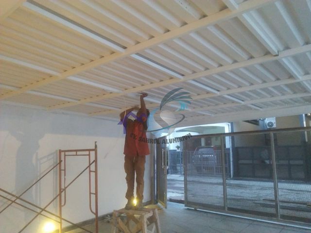 Pemasangan kanopi spandek rangka besi dan pagar carport oleh CV. Sahrul Aluminium
